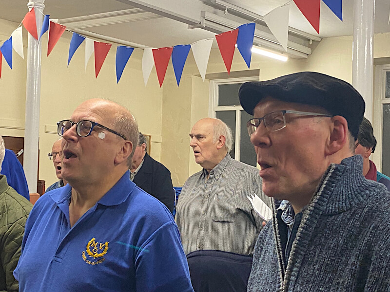 choir members relaxing before a rehearsal